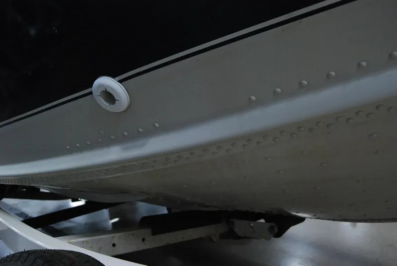 Slide: The Image of 1998 Smoker Craft 178 Fazer boat hull on trailer, close-up view. - 15