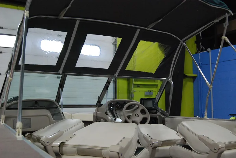 Slide: The Image of 1998 Smoker Craft 178 Fazer boat interior with canopy and seating. - 19