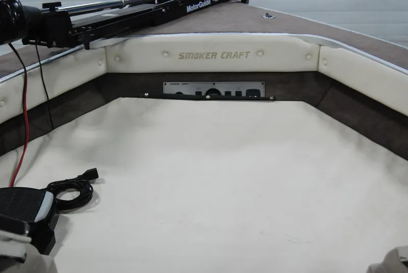 Slide: The Image of 1998 Smoker Craft 178 Fazer boat interior with control panel and seating area. - 24