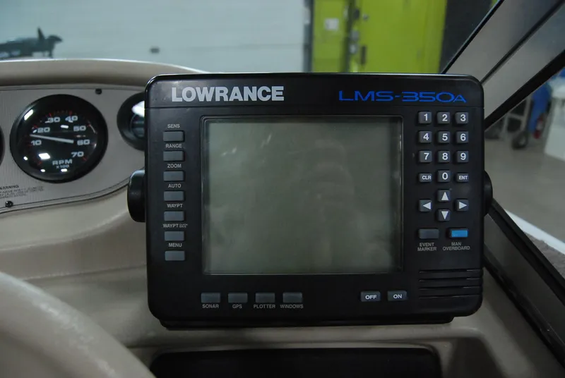 Slide: The Image of Lowrance LMS-350A fish finder on 1998 Smoker Craft 178 Fazer boat dashboard. - 25