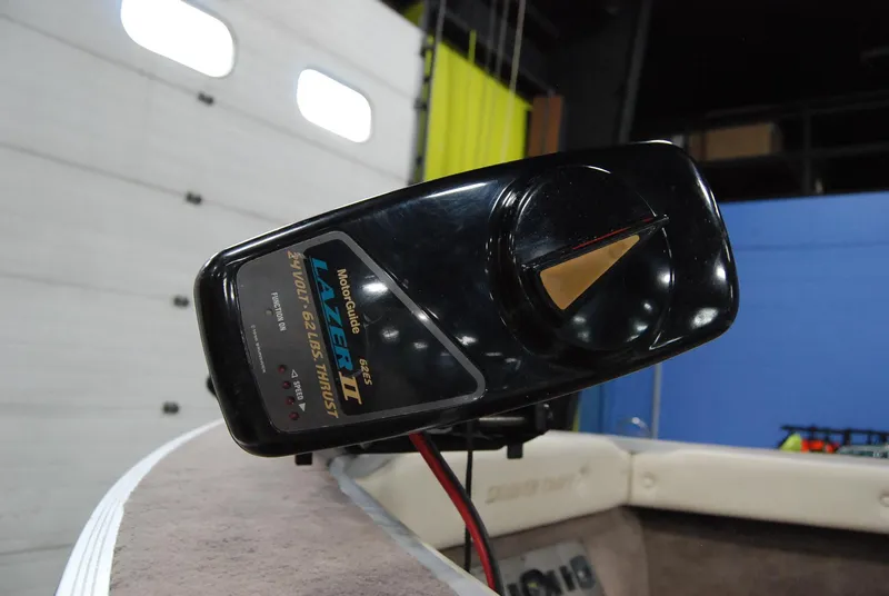 Slide: The Image of 1998 Smoker Craft 178 Fazer boat control panel in a garage setting. - 26