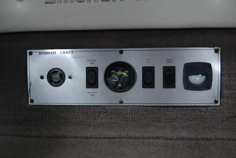 Slide: The Image of Control panel of a 1998 Smoker Craft 178 Fazer boat with gauges and switches. - 28