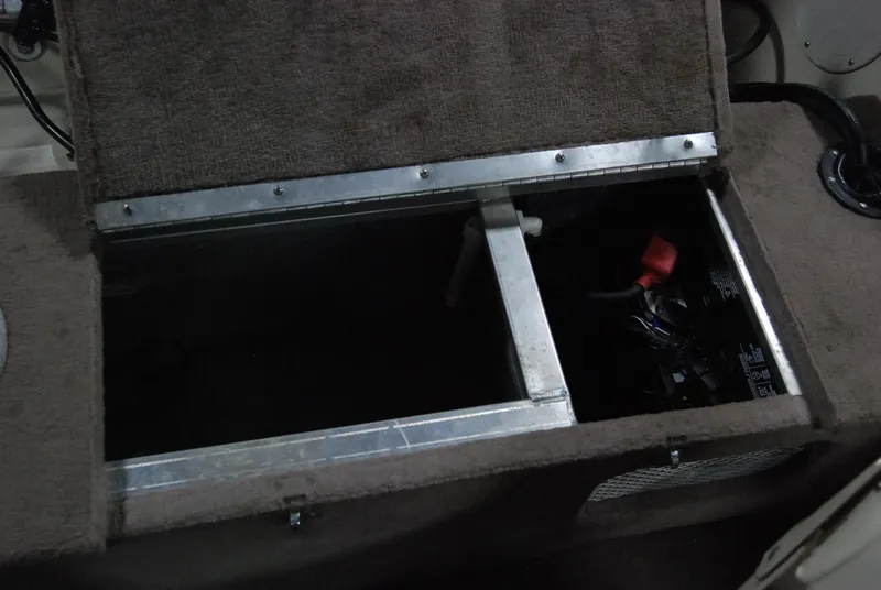 Slide: The Image of Open storage compartment in 1998 Smoker Craft 178 Fazer boat. - 32