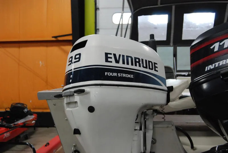 Slide: The Image of 1998 Smoker Craft 178 Fazer with Evinrude 9.9 four-stroke outboard motor. - 33