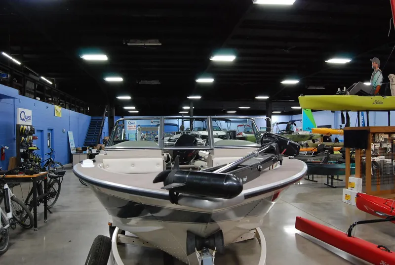 Slide: The Image of 1998 Smoker Craft 178 Fazer boat displayed indoors with various equipment. - 7