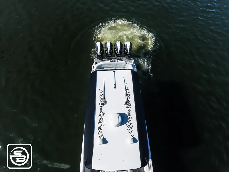 Slide: The Image of Aerial view of 2021 Nor-Tech 390 Sport boat with four engines on water. - 20