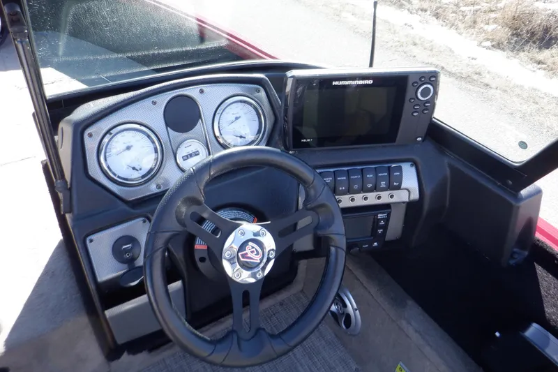 Slide: The Image of 2020 Alumacraft Competitor 165 Sport dashboard with steering wheel and navigation system. - 21