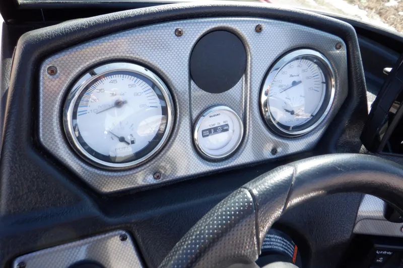 Slide: The Image of Dashboard of 2020 Alumacraft Competitor 165 Sport boat with gauges and steering wheel. - 25