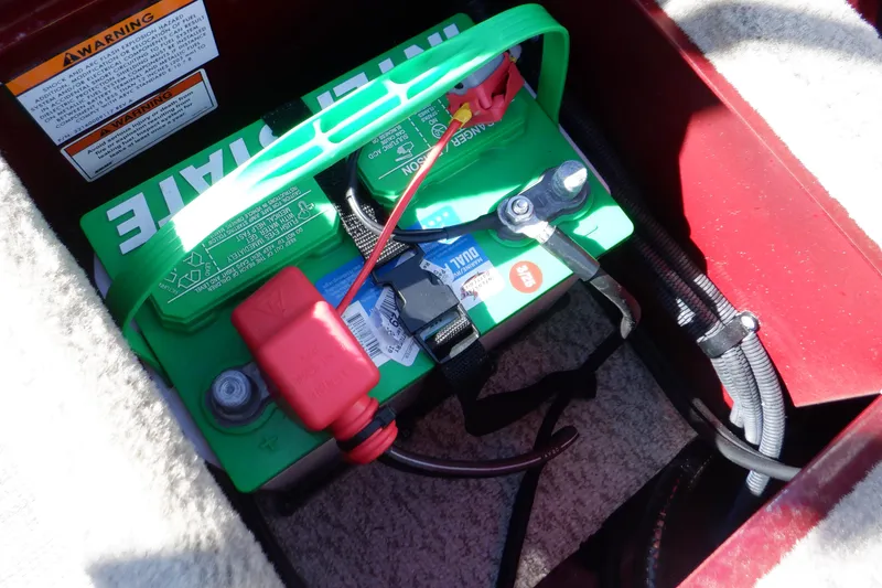 Slide: The Image of Battery compartment of 2020 Alumacraft Competitor 165 Sport boat, featuring Interstate battery. - 27