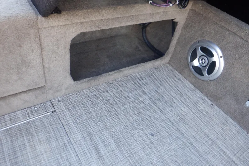 Slide: The Image of 2020 Alumacraft Competitor 165 Sport interior with speaker and storage compartment. - 42