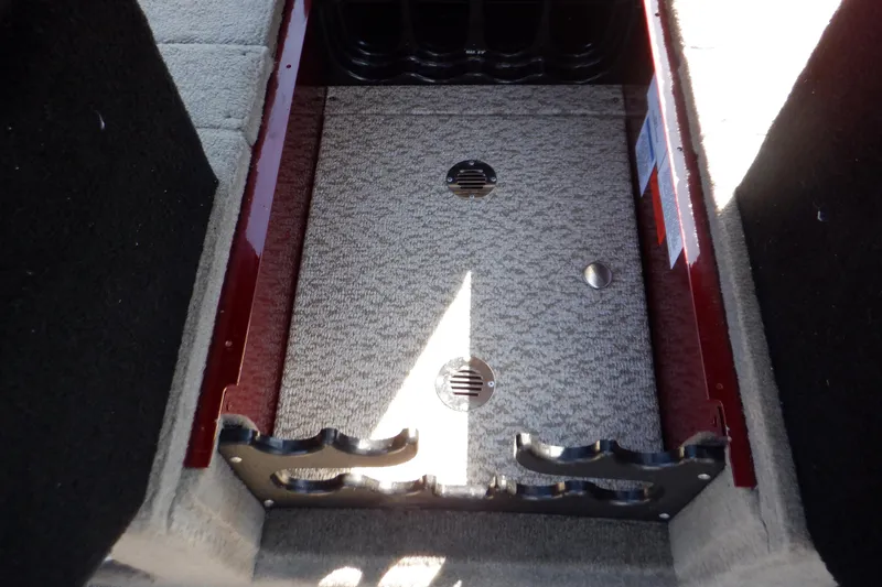 Slide: The Image of 2020 Alumacraft Competitor 165 Sport interior storage compartment with carpeted finish. - 44