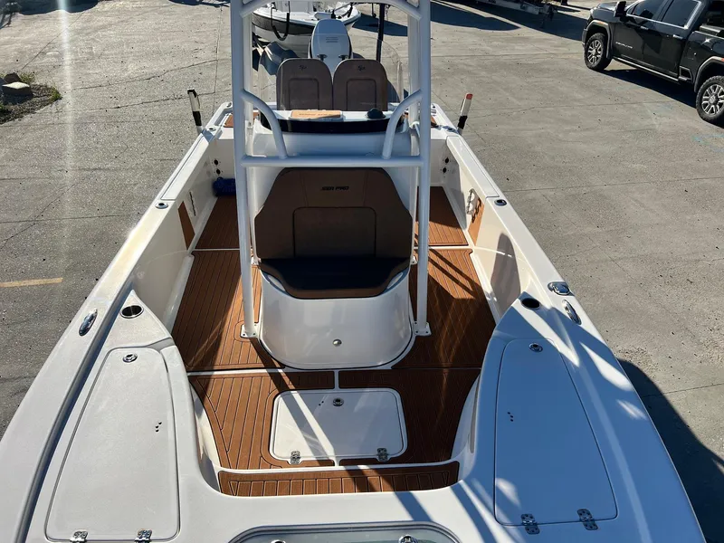 Slide: The Image of 2024 Sea Pro 250 Bay boat with sleek deck design and modern features. - 24