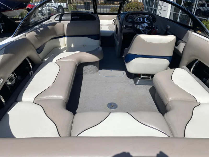 Slide: The Image of 2007 Malibu Wakesetter VLX interior with beige and white seating, spacious layout. - 10