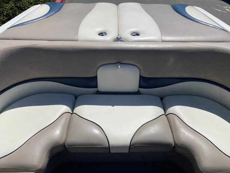 Slide: The Image of 2007 Malibu Wakesetter VLX boat interior with beige and blue seating. - 12