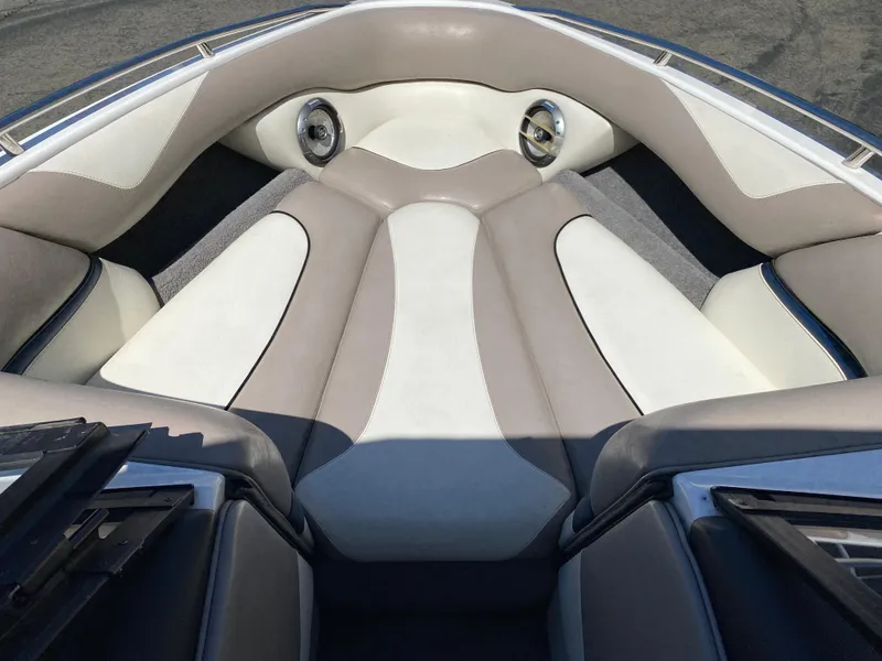 Slide: The Image of 2007 Malibu Wakesetter VLX boat interior with cushioned seating and built-in speakers. - 13