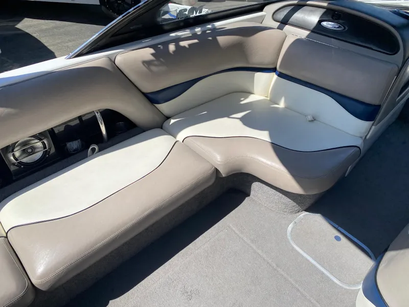 Slide: The Image of 2007 Malibu Wakesetter VLX interior with beige and blue seating. - 14