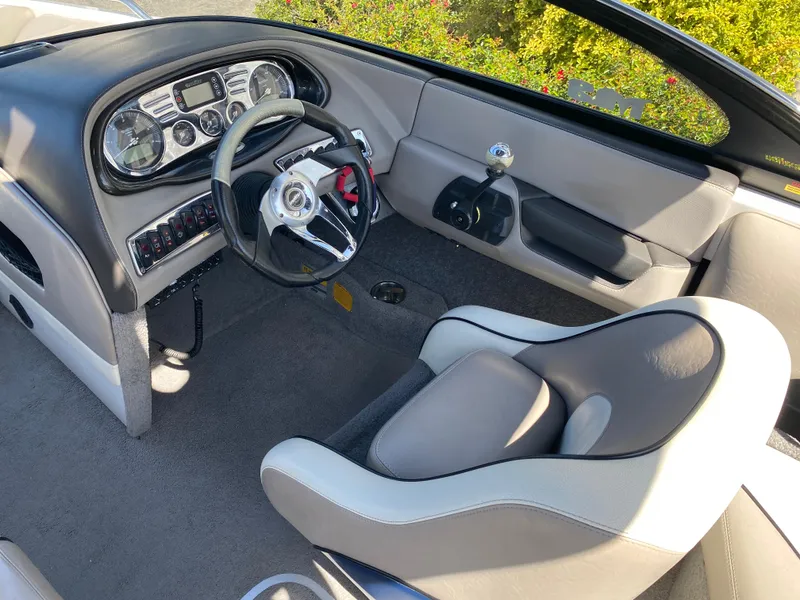 Slide: The Image of 2007 Malibu Wakesetter VLX boat interior with steering wheel and dashboard. - 15