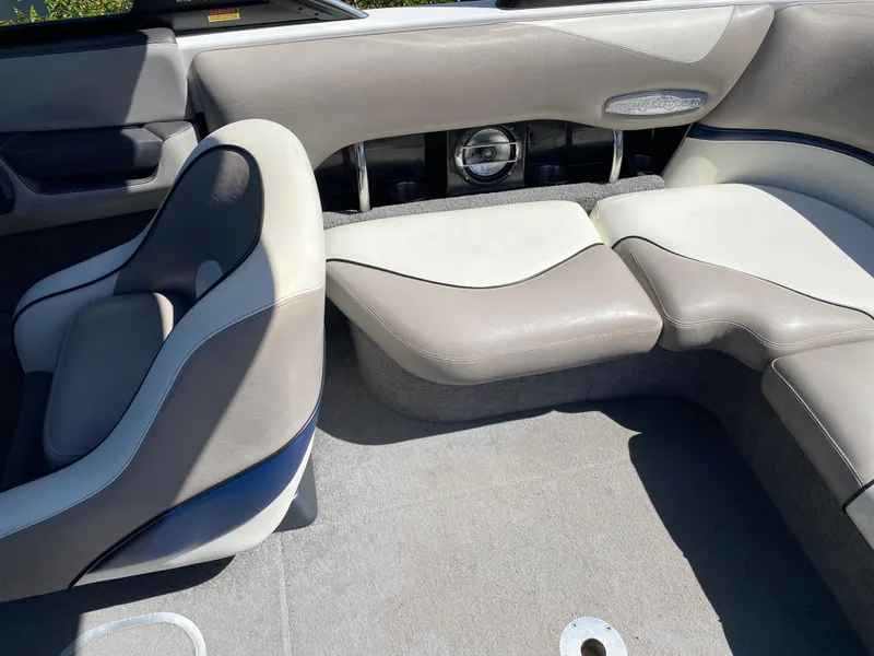 Slide: The Image of 2007 Malibu Wakesetter VLX interior with beige and gray seating, featuring a sleek design. - 16