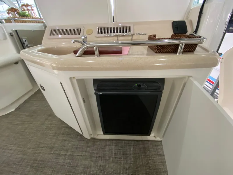 Slide: The Image of 2006 Sea Ray 40 Motor Yacht interior with kitchenette and mini fridge. - 11