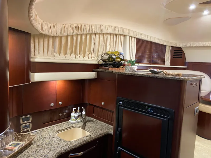 Slide: The Image of Luxurious 2006 Sea Ray 40 Motor Yacht interior with elegant kitchen and modern amenities. - 17