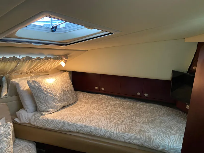 Slide: The Image of Cozy bedroom in 2006 Sea Ray 40 Motor Yacht with skylight and elegant bedding. - 20