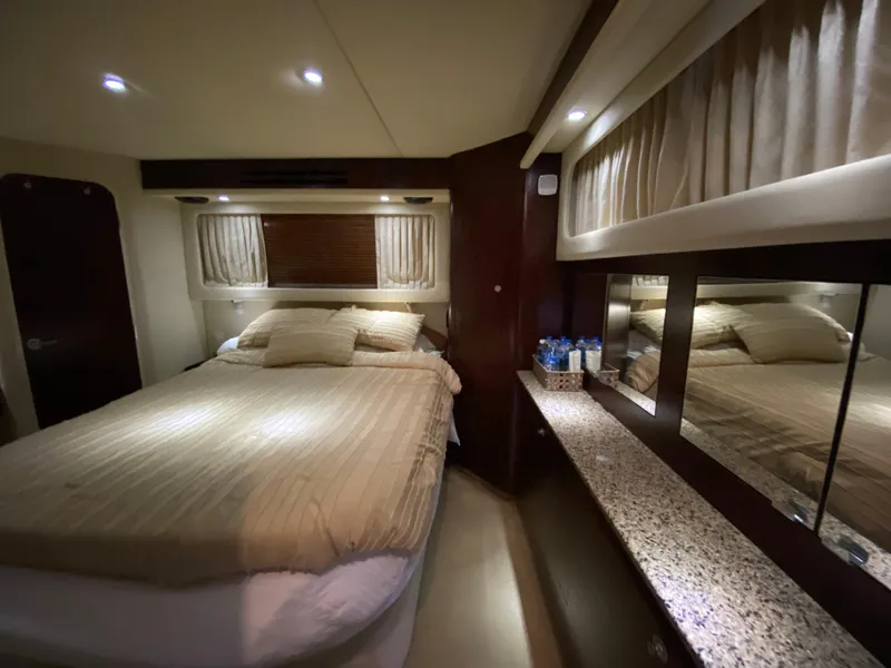 Slide: The Image of Luxurious bedroom interior of 2006 Sea Ray 40 Motor Yacht with cozy bed and elegant decor. - 27
