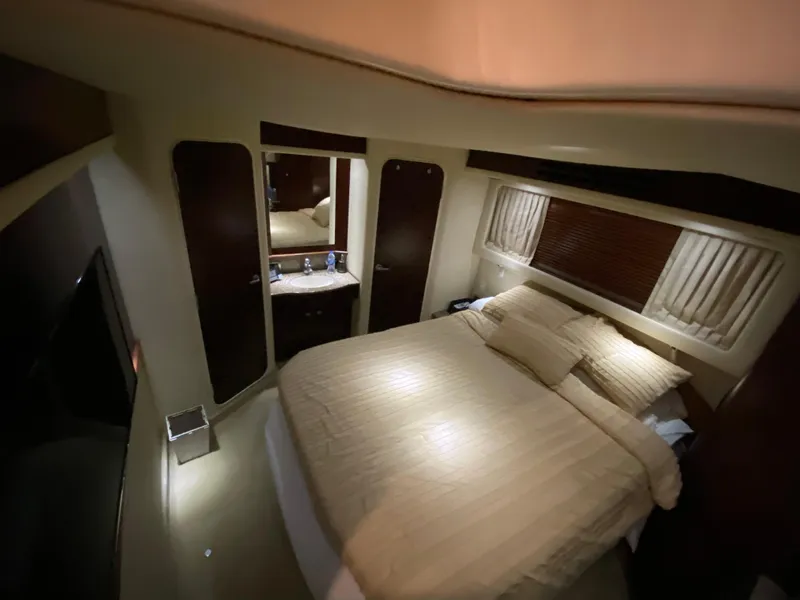 Slide: The Image of Luxurious bedroom interior of 2006 Sea Ray 40 Motor Yacht with cozy bedding. - 28