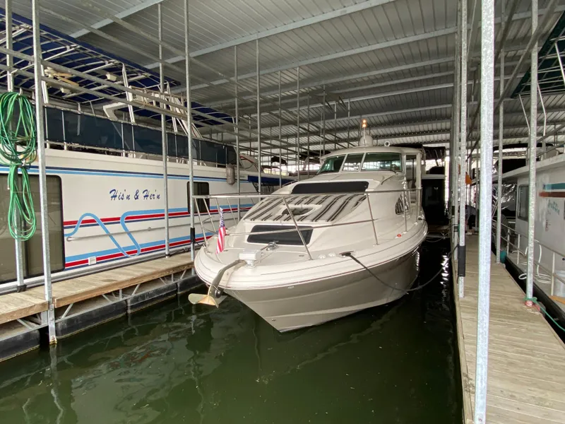 Slide: The Image of 2006 Sea Ray 40 Motor Yacht docked in a covered marina. - 31