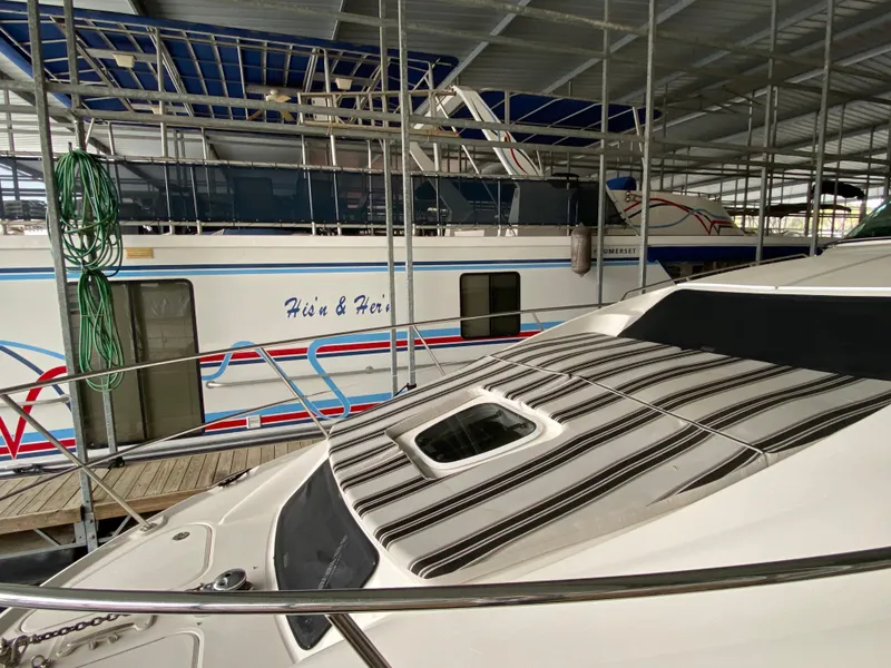Slide: The Image of 2006 Sea Ray 40 Motor Yacht docked in a marina, covered and secured. - 32