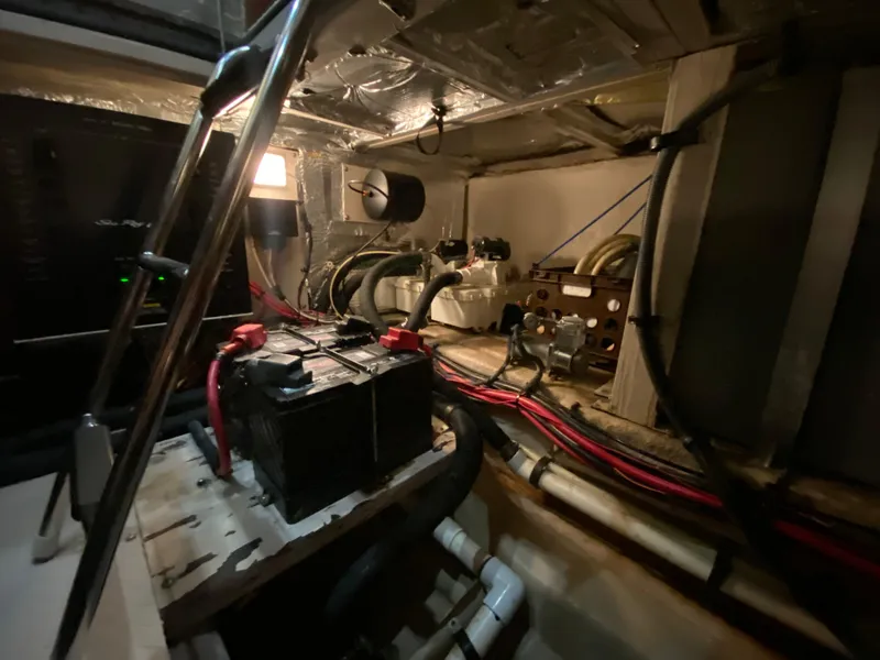 Slide: The Image of Engine room of a 2006 Sea Ray 40 Motor Yacht, featuring battery and wiring. - 41