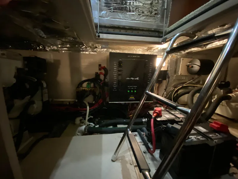 Slide: The Image of Engine room of 2006 Sea Ray 40 Motor Yacht with electrical panel and ladder. - 42
