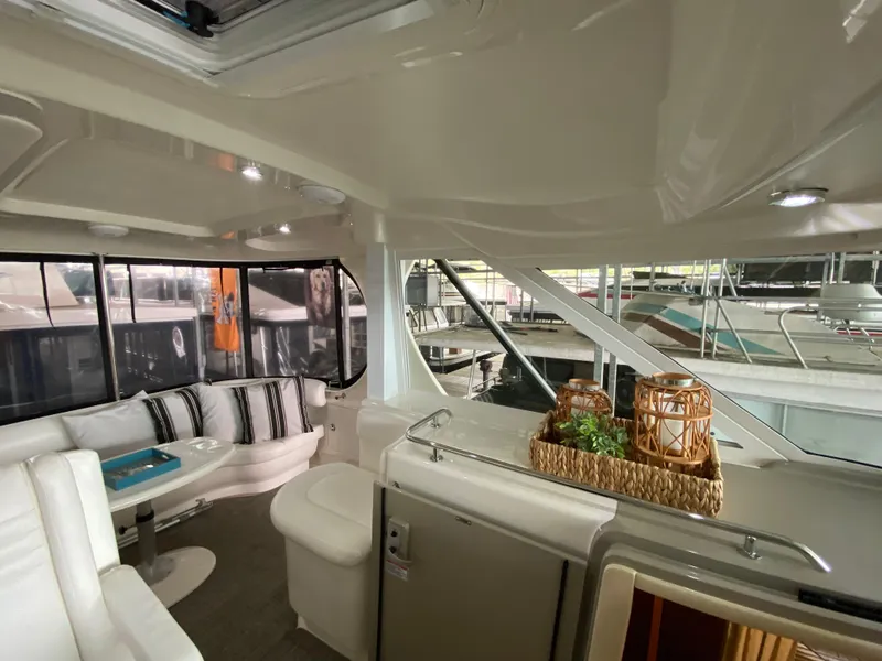 Slide: The Image of 2006 Sea Ray 40 Motor Yacht interior with elegant seating and decor. - 8