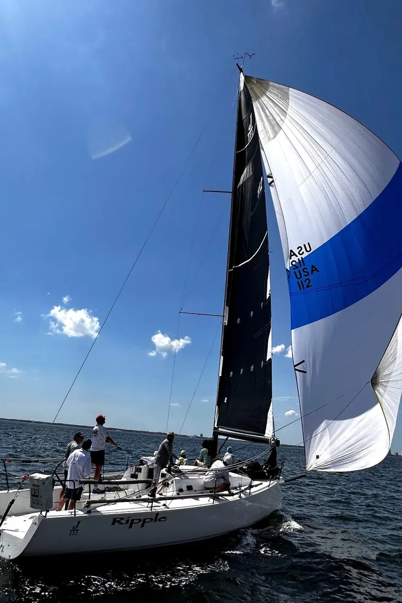 Slide: The Image of 2015 J Boats J 111 sailing on open water under clear blue skies. - 4