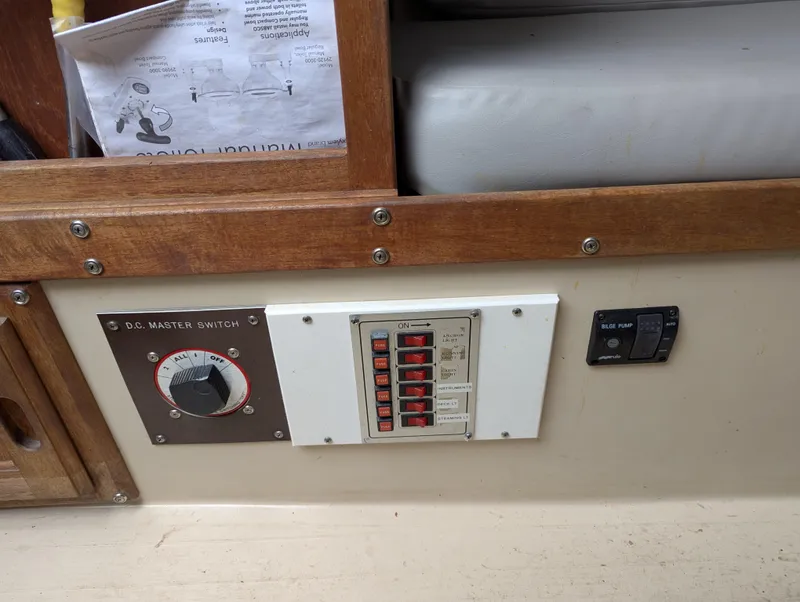 Slide: The Image of Electrical panel and switches on a 1983 Catalina 27 sailboat interior. - 19