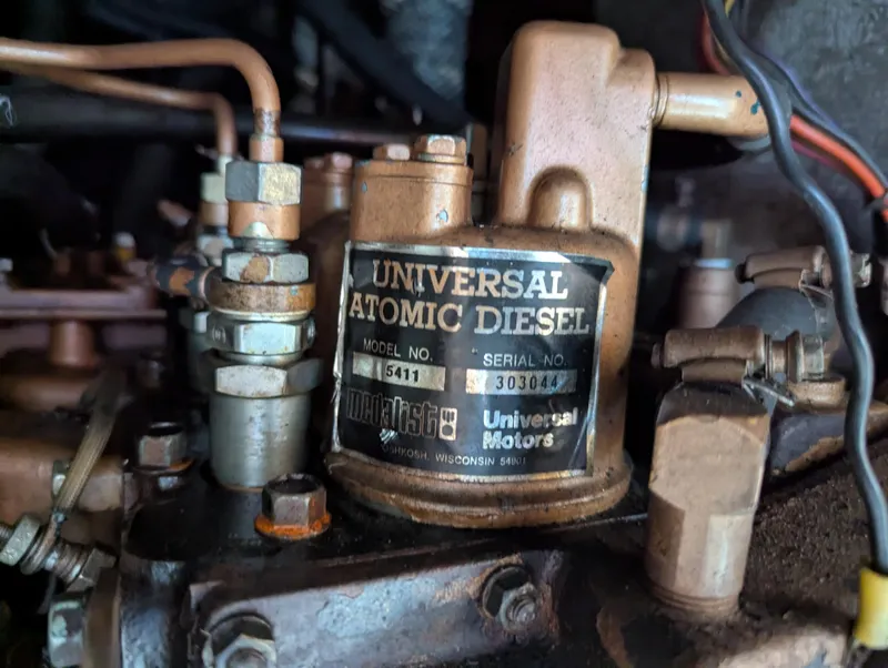 Slide: The Image of Universal Atomic Diesel engine in a 1983 Catalina 27 sailboat. - 21