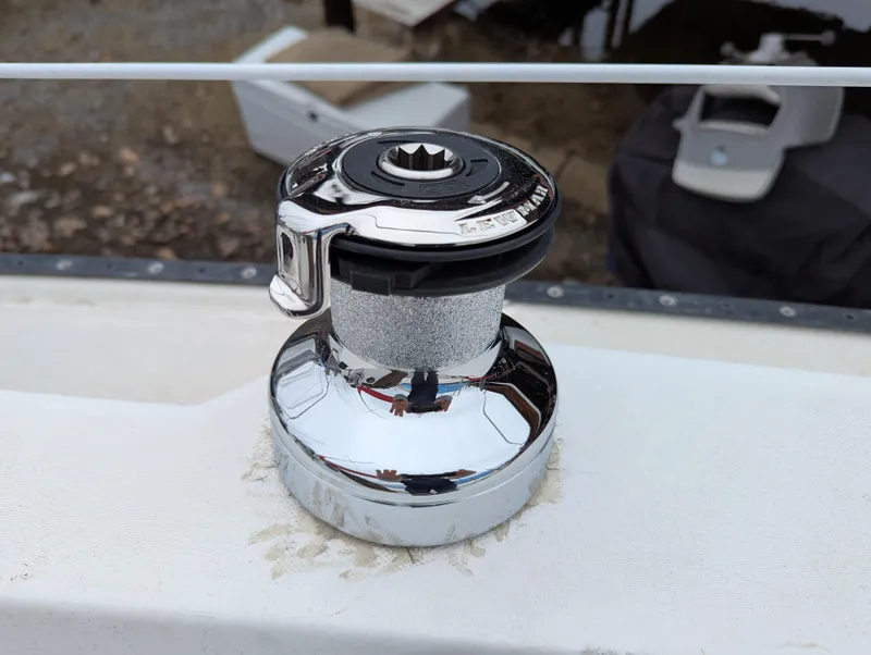 Slide: The Image of Chrome winch on 1983 Catalina 27 sailboat deck, used for sail handling. - 6