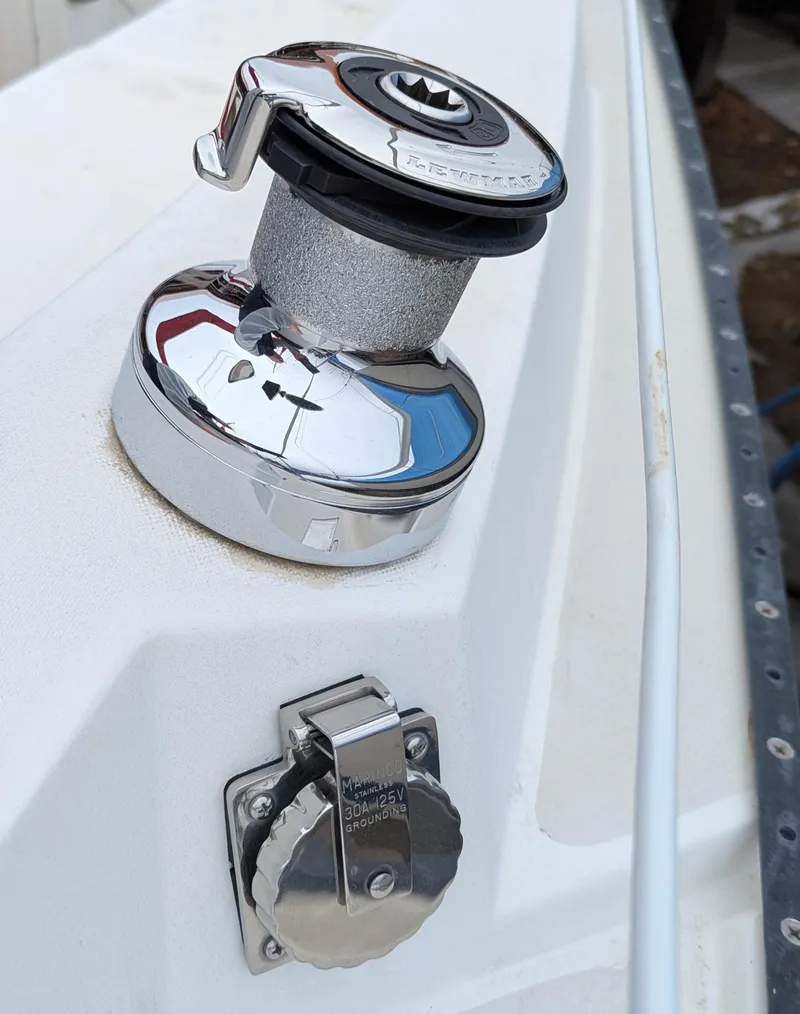 Slide: The Image of Chrome winch and fuel cap on 1983 Catalina 27 sailboat deck. - 7