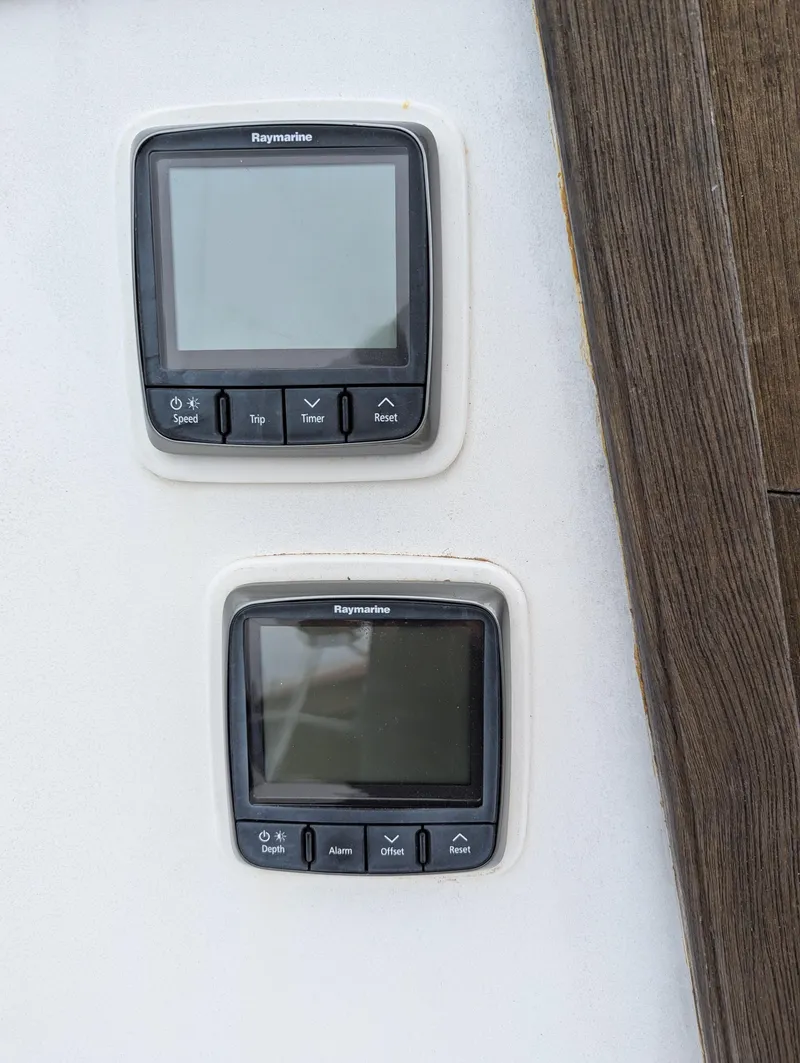 Slide: The Image of Raymarine displays on 1983 Catalina 27 sailboat, featuring navigation controls. - 8