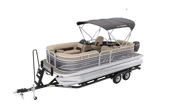 Slide: The Image of 2021 Sun Tracker Party Barge 20 DLX pontoon boat on trailer, featuring spacious seating and canopy. - 12
