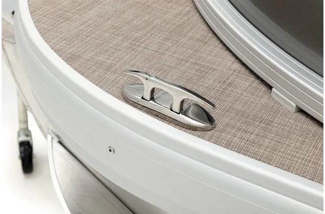 Slide: The Image of 2021 Sun Tracker Party Barge 20 DLX boat cleat on textured deck surface. - 30