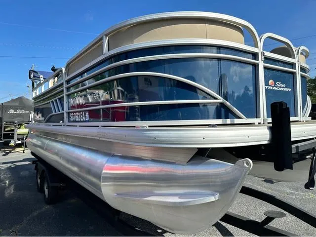 Slide: The Image of 2021 Sun Tracker Party Barge 20 DLX pontoon boat on trailer, side view. - 4