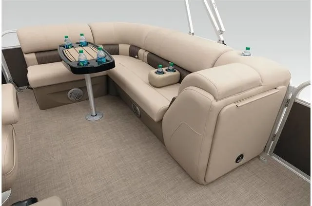 Slide: The Image of 2021 Sun Tracker Party Barge 20 DLX interior with beige seating and table. - 41