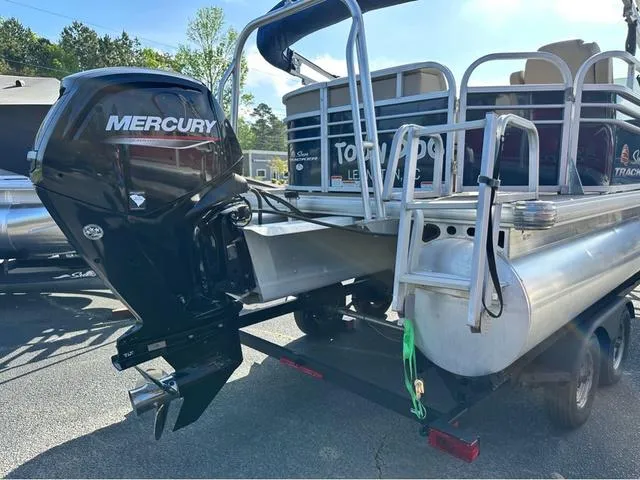 Slide: The Image of 2021 Sun Tracker Party Barge 20 DLX with Mercury outboard motor, rear view. - 5
