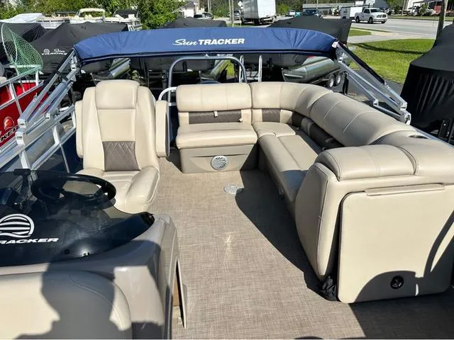 Slide: The Image of 2021 Sun Tracker Party Barge 20 DLX with spacious seating and canopy, ideal for leisure boating. - 8