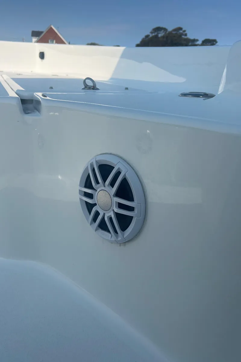 Slide: The Image of 2025 Pair Customs 24 Bay boat interior with speaker detail. - 26