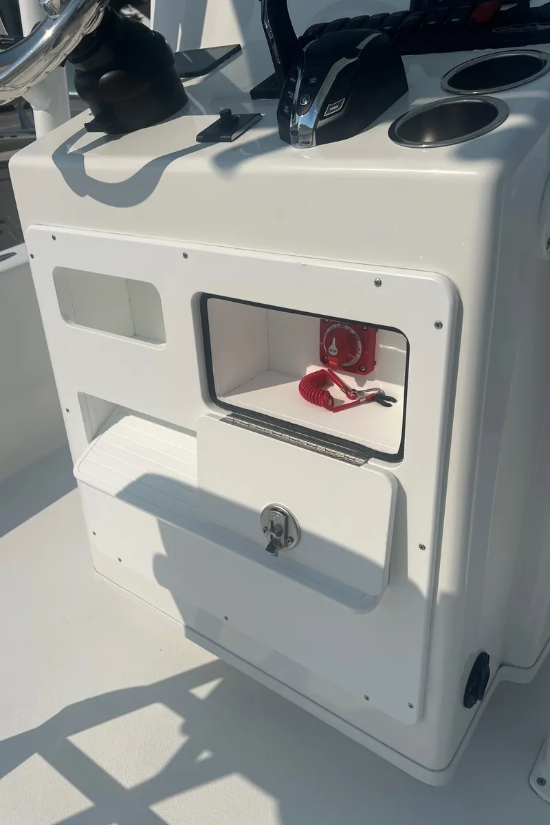 Slide: The Image of Control panel of 2025 Pair Customs 24 Bay boat with storage compartments. - 33