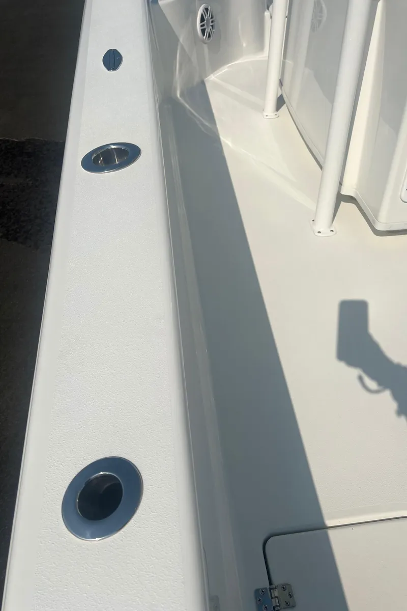Slide: The Image of 2025 Pair Customs 24 Bay boat deck with rod holders and clean design. - 34