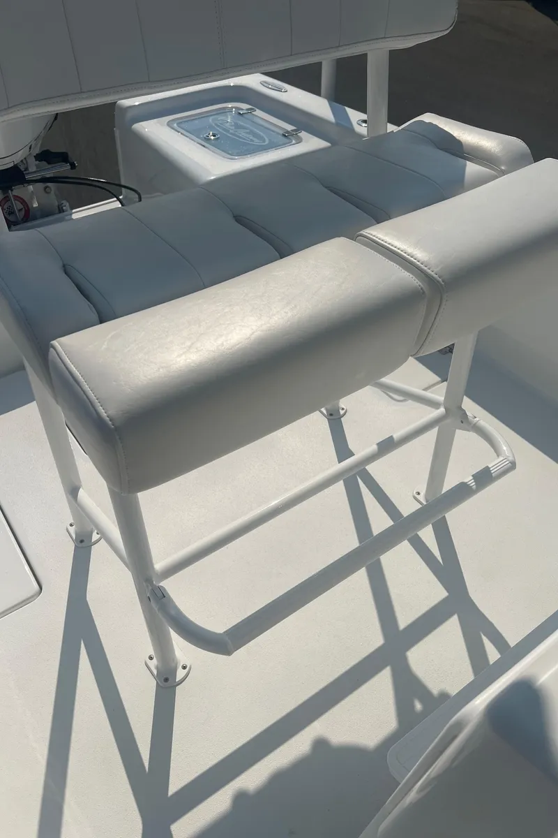 Slide: The Image of 2025 Pair Customs 24 Bay boat seat with white cushioned design. - 37