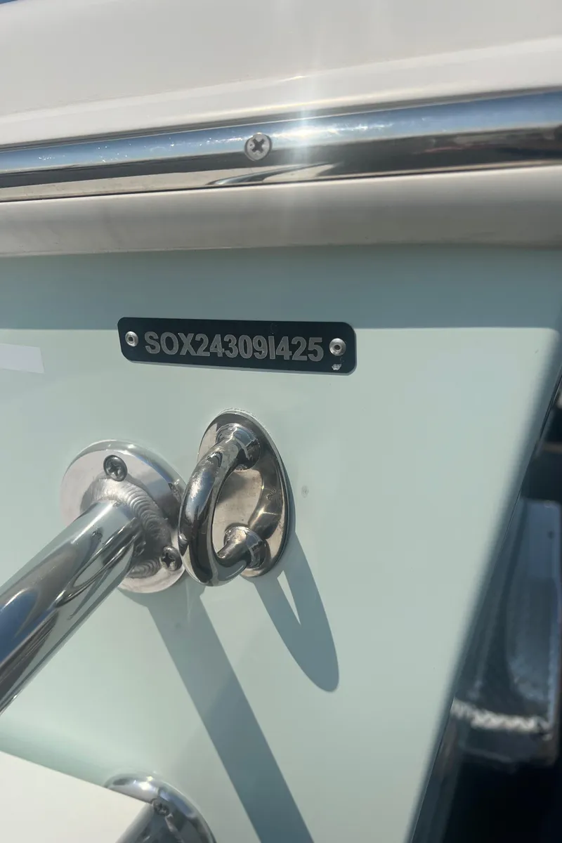 Slide: The Image of 2025 Pair Customs 24 Bay boat with visible serial number plate. - 40