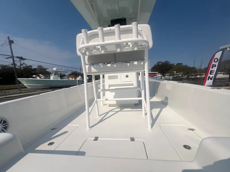 Slide: The Image of 2025 Pair Customs 24 Bay boat interior with seating and open deck. - 7